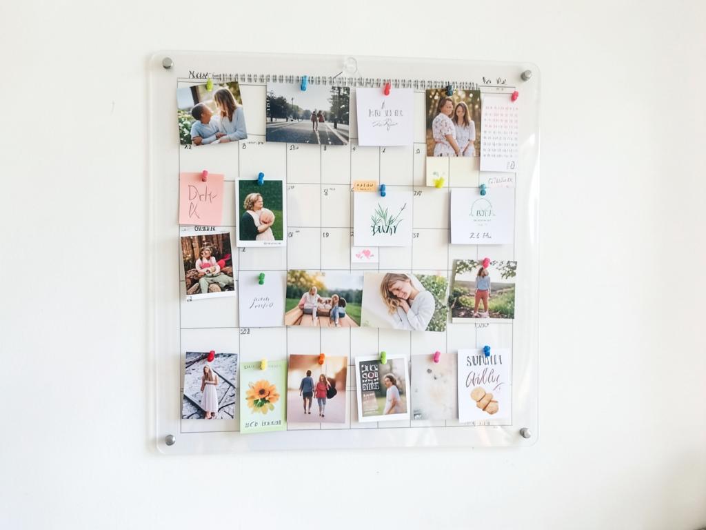 Transparent year planner over a vision board of goal cards and photos